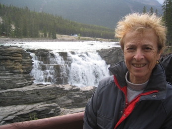 Ann Barbara before a Yellowstone waterfall.Patience, this 347×260 image (72 KB) may take a while to load.