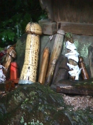 Wooden phallus fertility offerings.