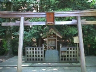 A small ancient shrine seen through its torii.