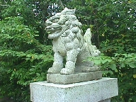 Guardian lion (shi-shi) with open mouth.