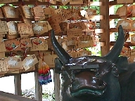 Within the stall: 
  a sculptured bull.