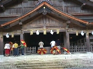Worshippers before the exterior of Miho Jinja shrine.
