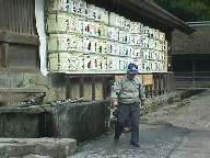 Sake barrels lining a sanctuary wall.